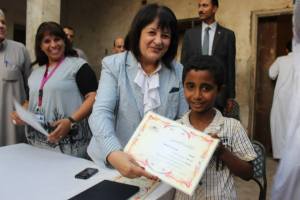 Young learner receives certificate
